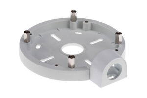 Ein grauer, runder Halter mit mehreren vertikal stehenden Metallstiften und einer Öffnung an der Seite.