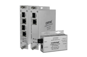 Drei silberne Medienkonverter von ComNet, mit Ports und Beschriftungen auf der Vorderseite.