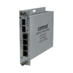 Ein Netzwerk-Switch von Comnet mit mehreren Ethernet-Ports und silbernem Gehäuse.
