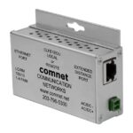 Ein silbernes elektronisches Gerät mit der Aufschrift "comnet COMMUNICATION NETWORKS", das über Ethernet- und erweiterte Distanzanschlüsse verfügt. Es scheint ein Netzwerkgerät zu sein.