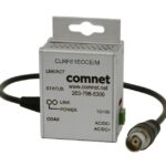 Ein ComNet-Gerät mit der Bezeichnung CLRFE1EOCE/M, einem Coax-Anschlusskabel und Statusanzeigen.