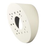 Ein weißes, halbkreisförmiges Wandregal mit mehreren kleinen runden Löchern.