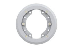 Grauer kreisförmiger Plastikadapter mit mehreren Löchern und Markierungen.