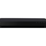 Schwarzer WISENET Netzwerk-Videorekorder mit mehreren Anschlüssen auf der rechten Seite.