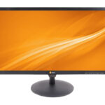 Ein schwarzer Computermonitor mit einem orangefarbenen Bildschirm, der ein abstraktes Muster zeigt.