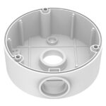 Eine runde weiße Kunststoffdose mit mehreren Öffnungen und inneren Strukturen.