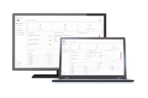 Ein Monitor und ein Laptop zeigen eine Software-Oberfläche mit Diagrammen und Daten.