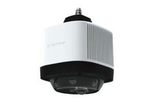 Eine moderne, zylinderförmige Überwachungskamera mit weißem Gehäuse und schwarzer Basis, die an die Decke montiert wird.