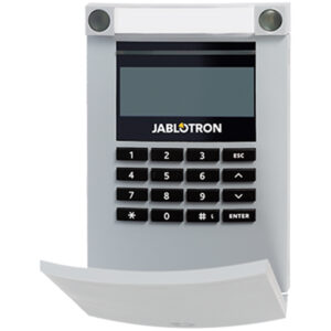 Ein graues Jablotron-Bedienpanel mit einem numerischen Tastenfeld, einem kleinen Display und Funktionstasten, das Teil eines Sicherheitssystems ist.