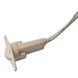 Nahaufnahme eines beige Kunststoff-Flächensensors mit abgerundetem Gehäuse und einem Kabel, das daran befestigt ist.