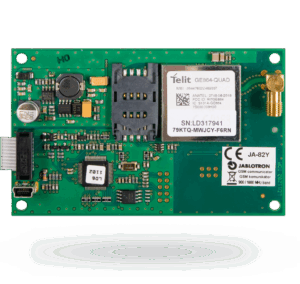 Eine elektronische Platine mit verschiedenen elektronischen Komponenten, darunter ein Telit-Modul GE864-QUAD und ein Slot für eine SIM-Karte. Beschriftung mit CE-Kennzeichnung und Hinweis auf einen GSM-Kommunikator von Jablotron.