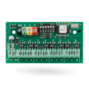 Eine grüne elektronische Schaltplatine mit mehreren Anschlüssen, Dip-Schaltern und einem Chip, markiert mit "LY6 8002".