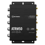 Schwarzes Teltonika ATRM50-Gerät mit verschiedenen Anschlüssen und Beschriftungen, darunter "Made in Lithuania" und "eSIM".