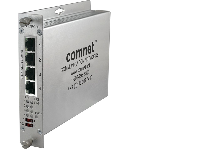 Ein silberner Netzwerk-Switch von Comnet mit vier Ethernet-Ports und Modellinformationen auf der Seite.