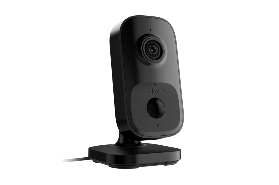 Schwarze Überwachungskamera mit rechteckigem Gehäuse und integriertem Sockel, Kabelanschluss sichtbar.