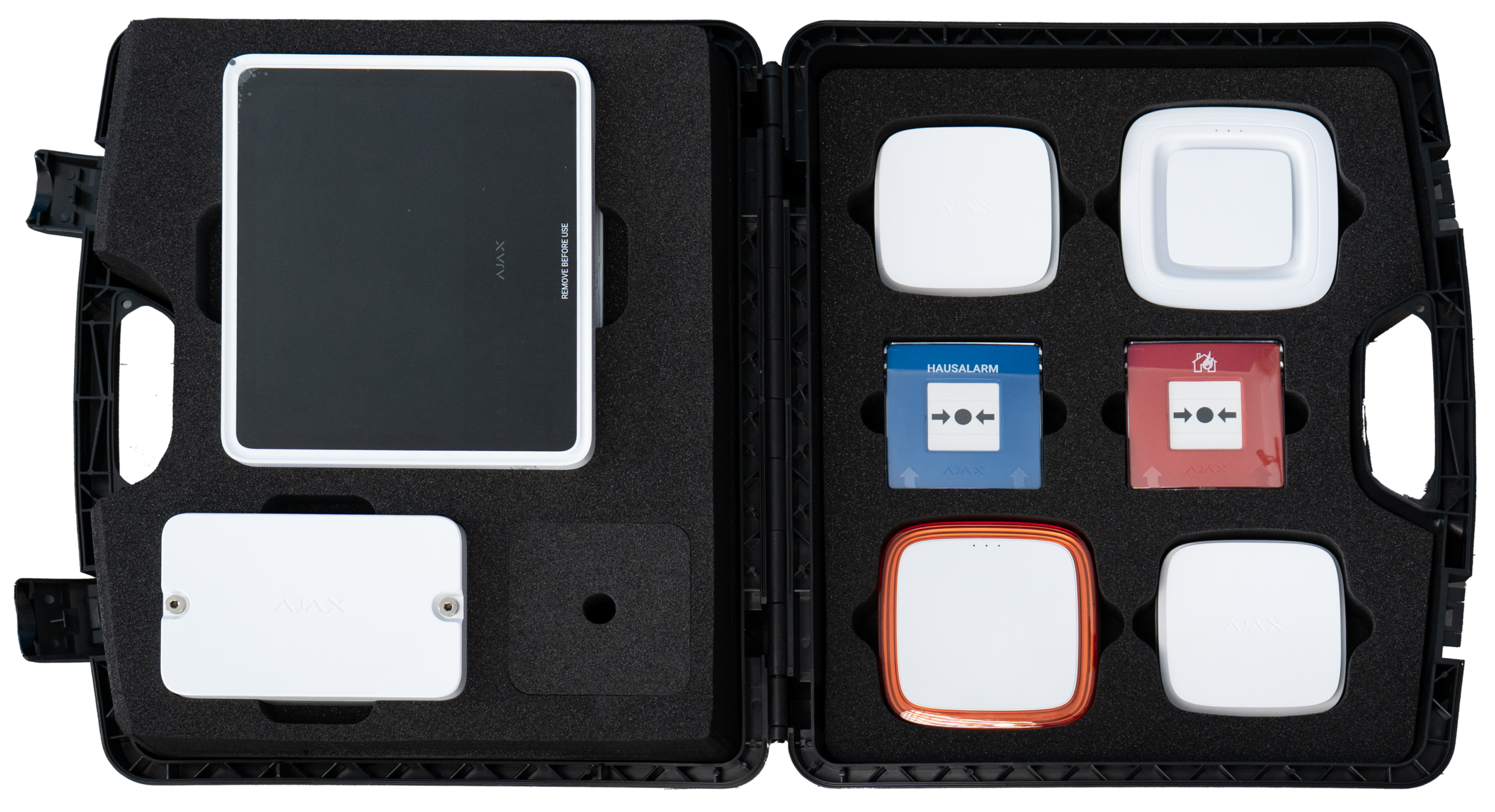 Offener Koffer mit mehreren elektronischen Geräten in Schaumstoff-Aussparungen, darunter schwarze, weiße und farbige Module.