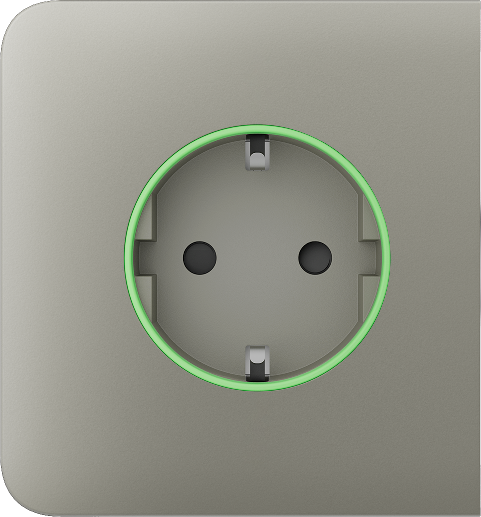 Eine graue Steckdose mit einem grünen Leuchtring um den Steckplatz.