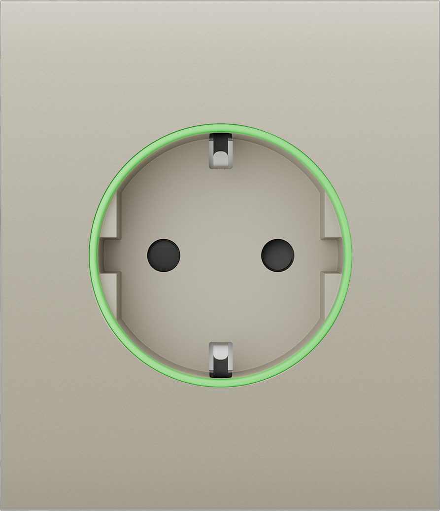 Nahaufnahme einer Steckdose mit grünem Lichtkreis.