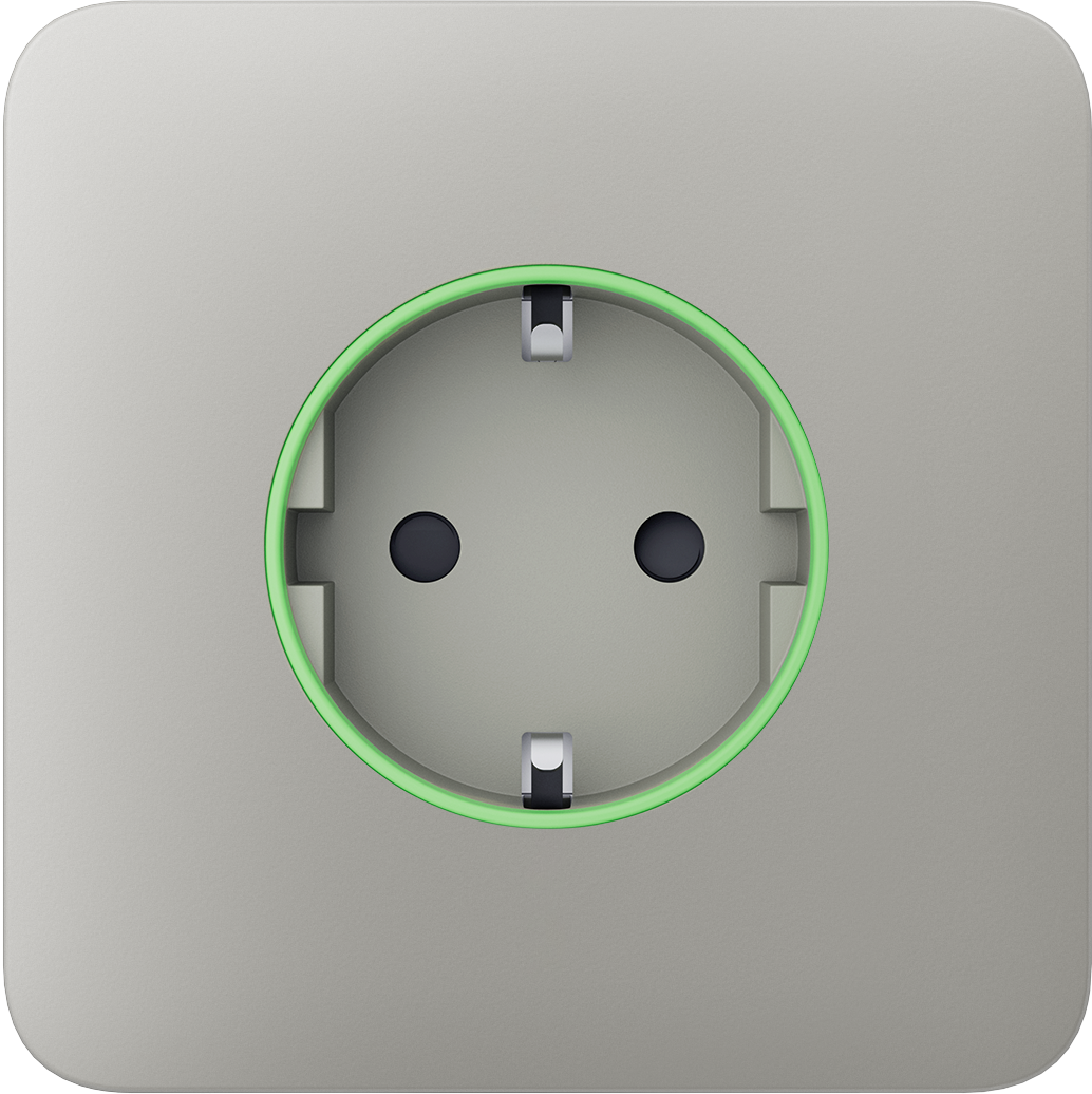 Nahaufnahme einer Steckdose mit grünem Leuchtring auf grauer Abdeckung.