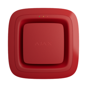 Rotes quadratisches Gerät mit abgerundeten Ecken und dem Wort "AJAX" in der Mitte, drei kleine Lichter oben.