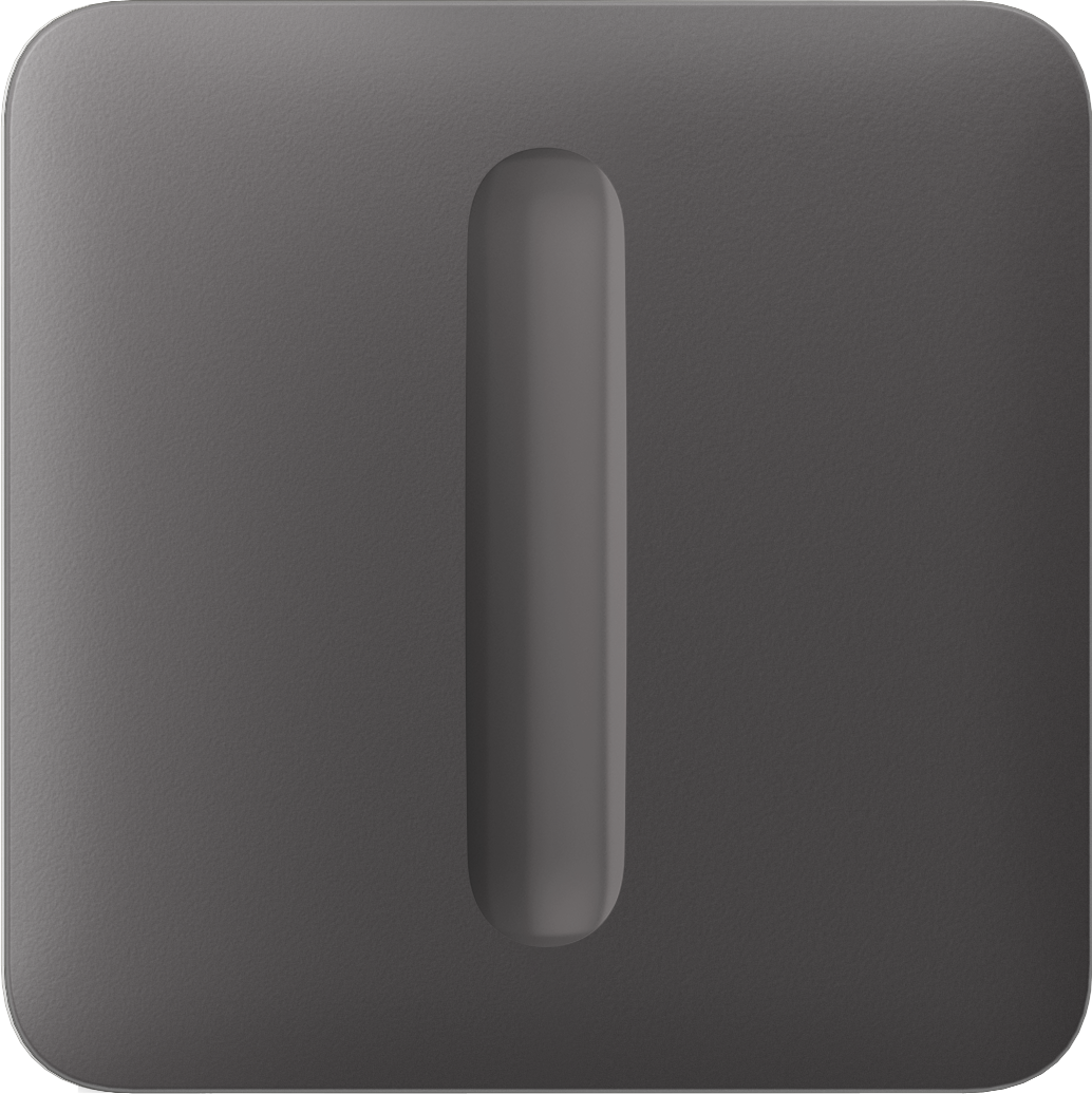 Kompakte schwarze Taste mit runder Erhebung in der Mitte.