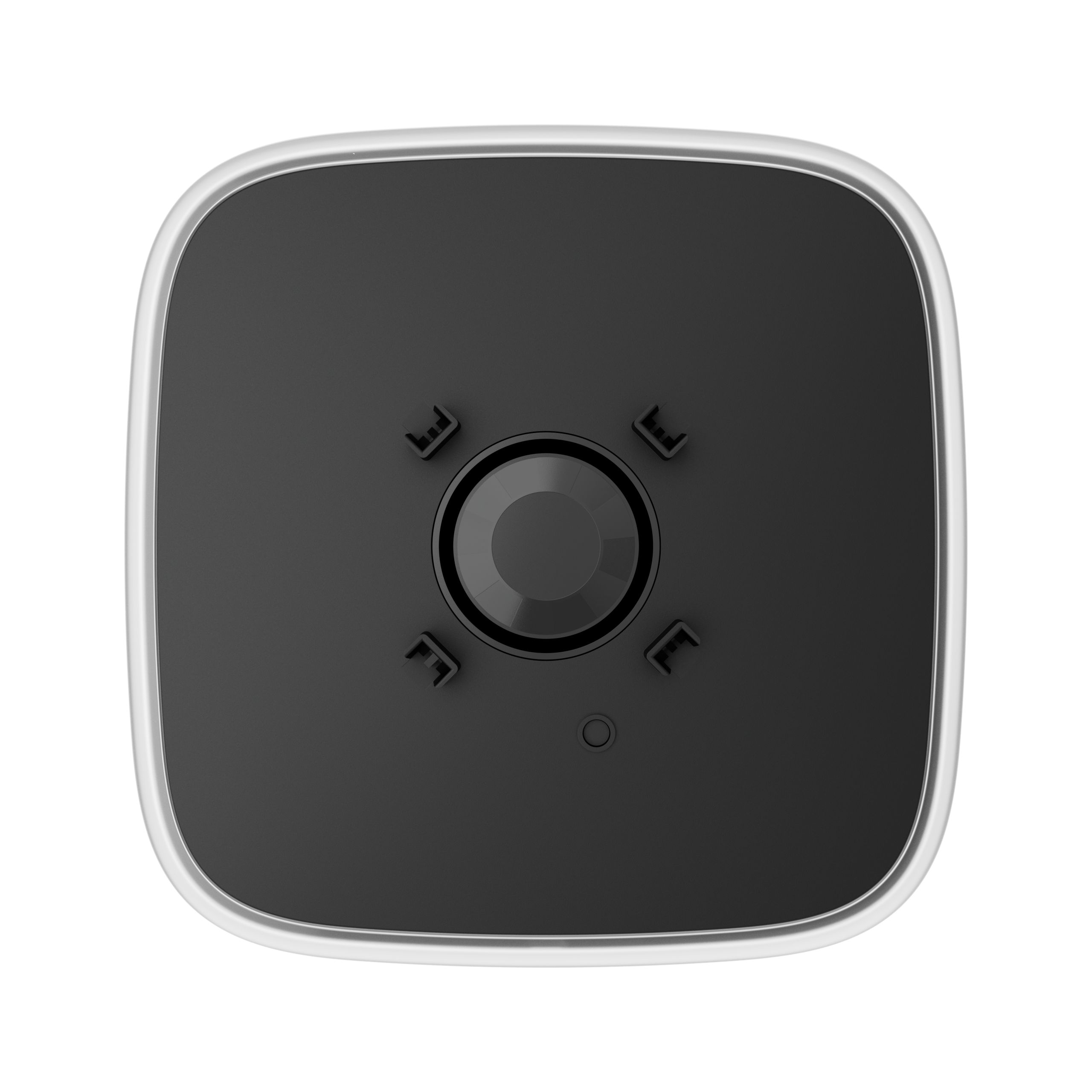 Schwarzes quadratisches Gerät mit zentralem rundem Objektiv und vier kleinen Löchern in den Ecken auf schwarzem Hintergrund.