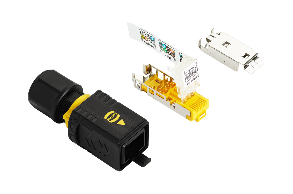 Ein modulares Netzwerkkabel und ein Steckverbinder in Einzelteilen, mit sichtbaren Anschlüssen und Beschriftungen.
