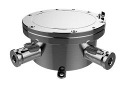 Ein metallisches zylindrisches Gerät mit einem runden Deckel und zwei seitlichen Anschlüssen, wahrscheinlich ein technisches Bauteil oder eine Komponente.