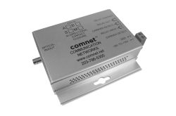 Ein silbernes elektronisches Gerät mit der Aufschrift "comnet COMMUNICATION NETWORKS" und verschiedenen technischen Aufdrucken.
