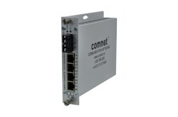 Ein silberner Kommunikationsnetzwerk-Konverter von Comnet mit mehreren Ethernet-Anschlüssen.
