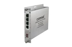 Ein silberner Netzwerk-Switch von ComNet mit vier Ethernet-Ports und LED-Anzeigen auf der Vorderseite.