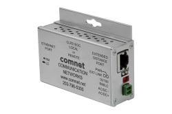 Ein Netzwerkgerät von ComNet mit Anschlüssen und Beschriftungen, montierbar an einer flachen Oberfläche.
