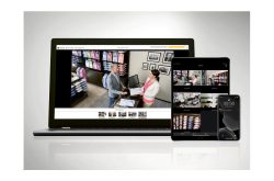 Ein Laptop, Tablet und Smartphone mit Sicherheitskamera-Überwachungsbildern eines Bekleidungsgeschäfts.