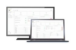 Ein Monitor und ein Laptop zeigen eine Software-Oberfläche mit Diagrammen und Daten.