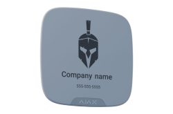 Ein graues, quadratisches Gerät mit abgerundeten Ecken, zeigt das Bild eines Helmes, den Text "Company name" und eine Telefonnummer. Unten ist das Logo "AJAX" sichtbar.