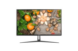 Ein Monitor zeigt ein Bild mit Mandarinen, Walnüssen, Tannenzweigen und Zapfen auf einem Holztisch.