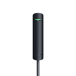 Ein schwarzer, zylindrischer Sensor mit einem kleinen grünen Licht auf einer schwarzen Hintergrund.