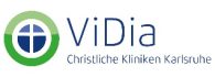 Logo von ViDia, Christliche Kliniken Karlsruhe, mit einem stilisierten Kreuz in einem grรผnen Kreis.