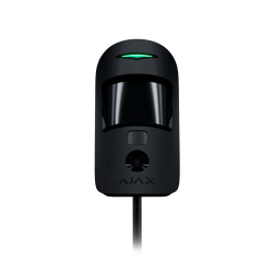 Schwarzer Sensor mit gewölbtem Glas, darunter ein kleines Objektiv und eine leuchtende grüne Anzeige auf schwarzem Hintergrund.